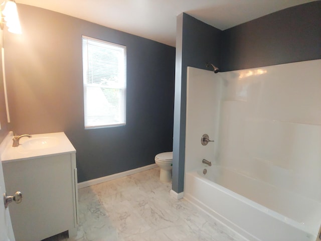 full bathroom featuring toilet, vanity, and tub / shower combination