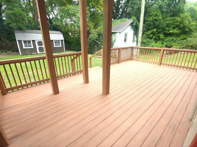 wooden deck featuring a storage unit