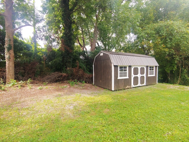 view of outbuilding with a lawn