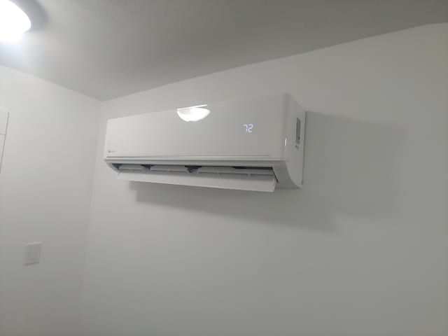 interior details featuring a wall mounted AC