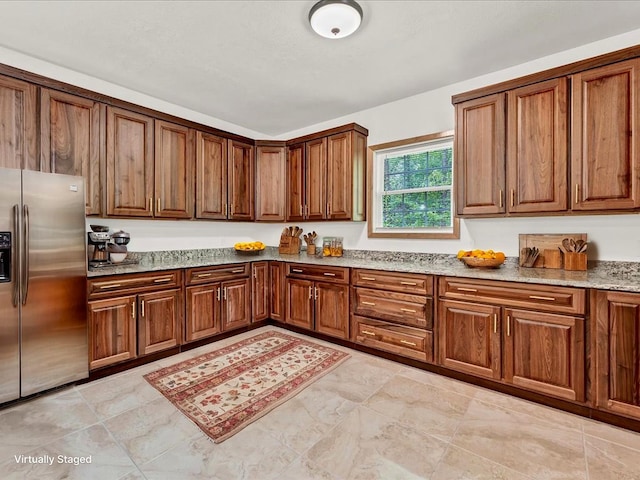 107 Straight Creek Dock Rd, New Tazewell, TN 37825 - kitchen featuring stainless steel fridge, light stone counters, and brown cabinetry