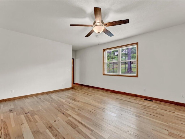 107 Straight Creek Dock Rd, New Tazewell, TN 37825 - empty room featuring ceiling fan, light wood finished floors, and baseboards