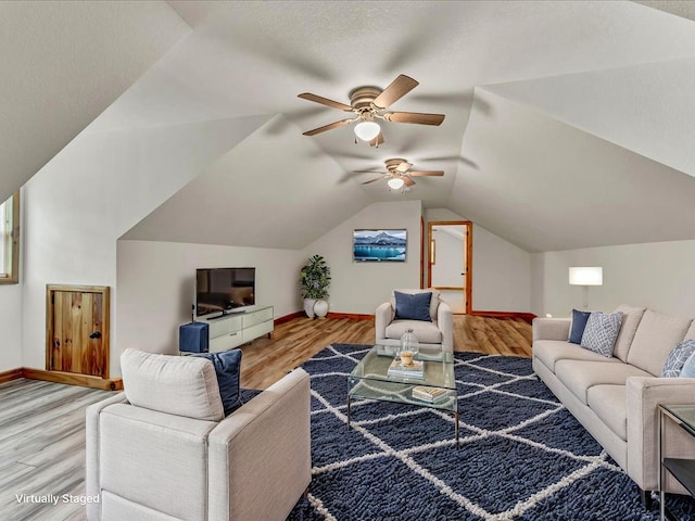 107 Straight Creek Dock Rd, New Tazewell, TN 37825 - living room with a ceiling fan, wood finished floors, baseboards, and vaulted ceiling