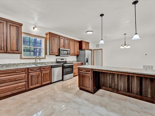 107 Straight Creek Dock Rd, New Tazewell, TN 37825 - kitchen with stainless steel appliances, a sink, light stone countertops, and a chandelier
