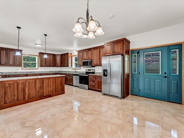 107 Straight Creek Dock Rd, New Tazewell, TN 37825 - kitchen featuring appliances with stainless steel finishes, a chandelier, decorative light fixtures, and light countertops