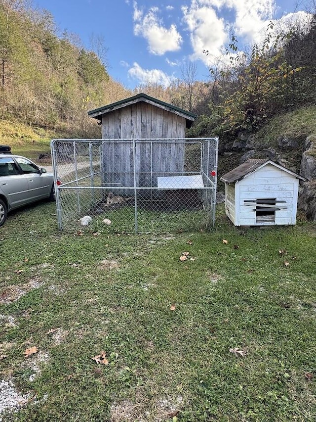 view of home's exterior with a storage shed