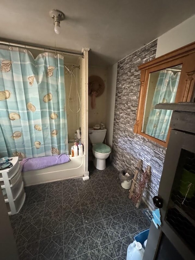 bathroom featuring shower / bath combo and toilet