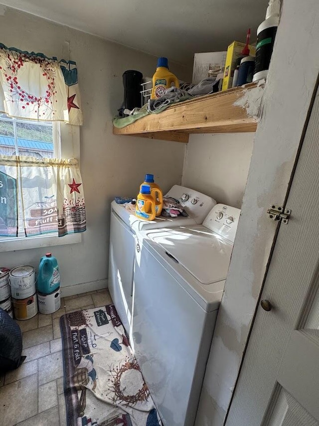 laundry area with washing machine and clothes dryer