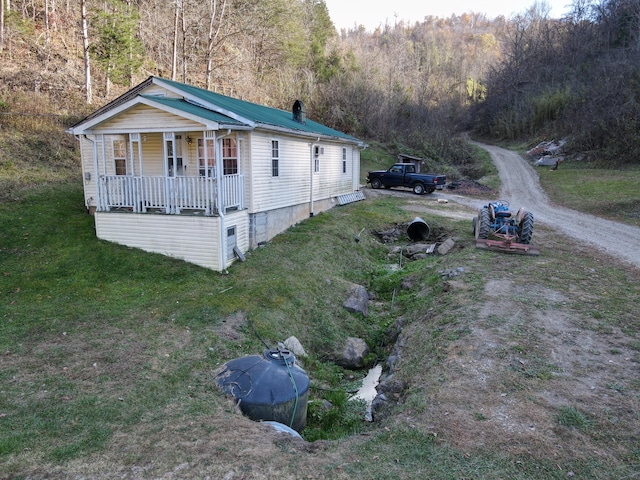 view of property exterior with a porch