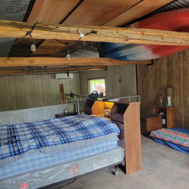 bedroom featuring wood walls