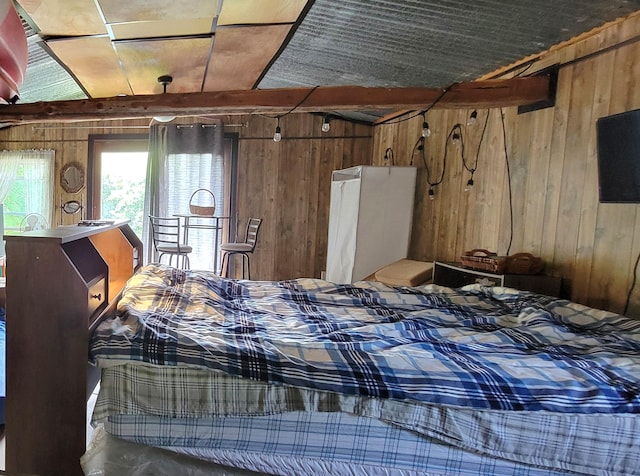 bedroom featuring wood walls