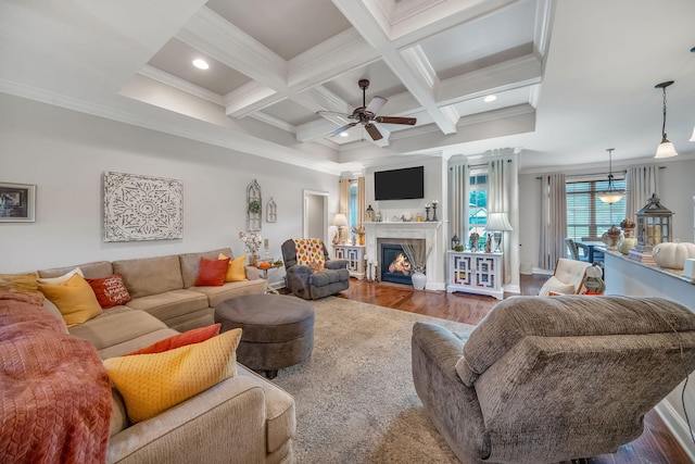 living room featuring beamed ceiling, wood-type flooring, crown molding, and coffered ceiling