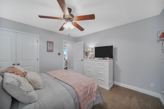 carpeted bedroom featuring ceiling fan and a closet