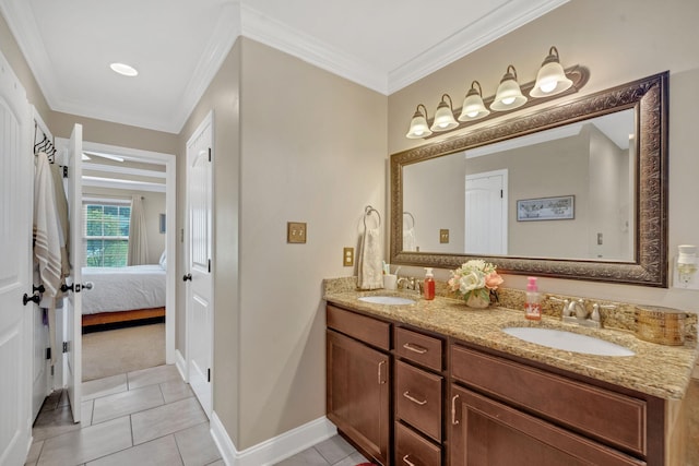 bathroom featuring tile patterned flooring, vanity, and ornamental molding