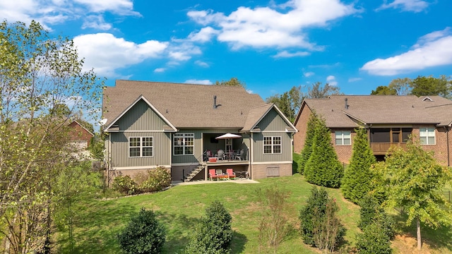 back of property featuring a yard and a deck