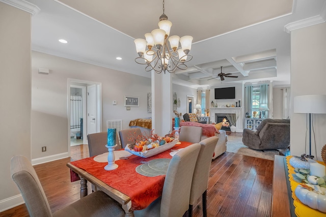 dining room with beamed ceiling, dark hardwood / wood-style flooring, ceiling fan with notable chandelier, and coffered ceiling