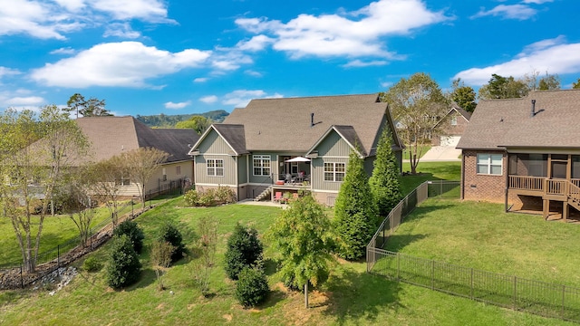 back of house featuring a yard