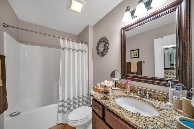 full bathroom with tile patterned flooring, shower / bath combo with shower curtain, vanity, and toilet