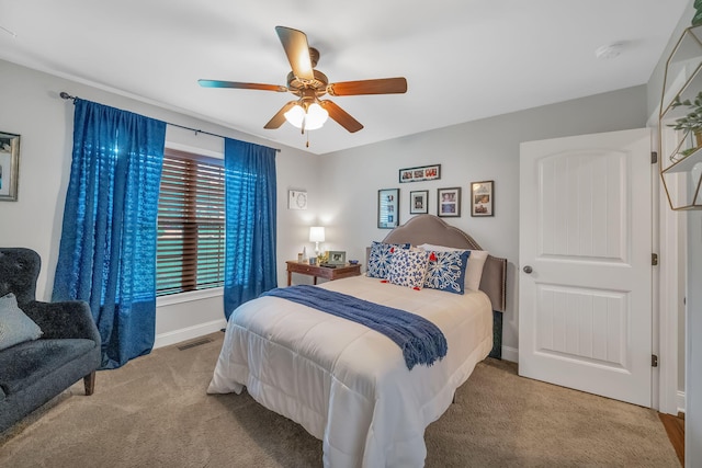 bedroom featuring ceiling fan and light carpet