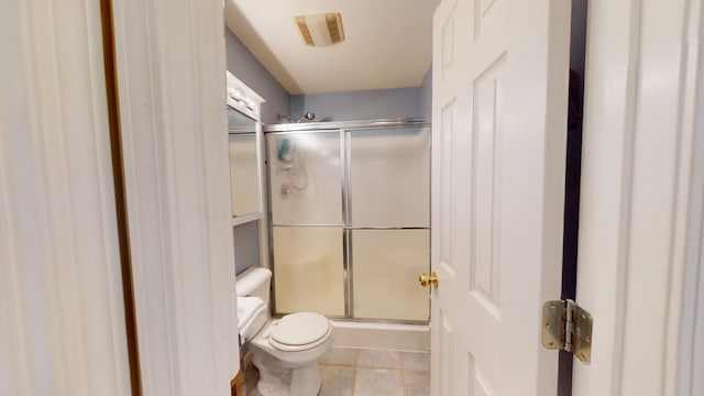 4119 Azalea Ct, Morristown, TN 37814 - bathroom featuring toilet, a stall shower, and tile patterned floors