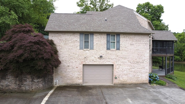 4119 Azalea Ct, Morristown, TN 37814 - view of property exterior featuring driveway, a garage, a shingled roof, and brick siding