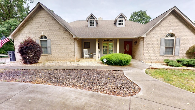 4119 Azalea Ct, Morristown, TN 37814 - view of front facade featuring a shingled roof, a porch, and brick siding
