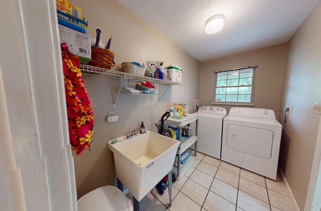4119 Azalea Ct, Morristown, TN 37814 - laundry room with independent washer and dryer, light tile patterned floors, and a textured ceiling