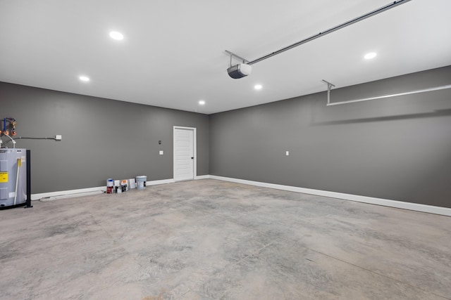 garage featuring electric water heater and a garage door opener