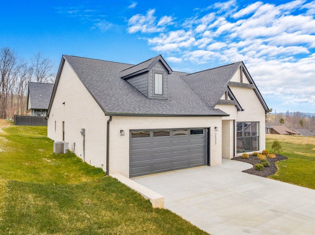 view of front of home with central AC unit, a garage, and a front lawn