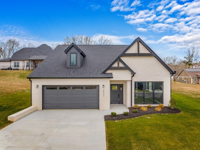 view of front of house featuring a front yard and a garage