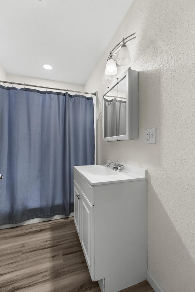 329 Shady Glen Ln, Rutledge, TN 37861 - bathroom with vanity, wood finished floors, a textured wall, and a shower with curtain
