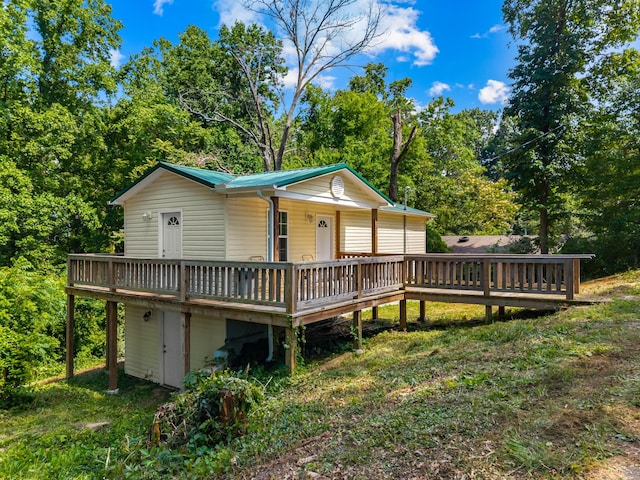 329 Shady Glen Ln, Rutledge, TN 37861 - view of front of house with a wooden deck, a metal roof, and view of wooded area