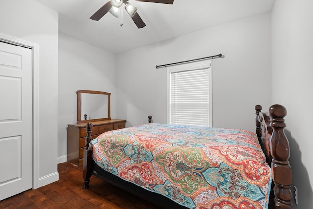 bedroom featuring ceiling fan and dark hardwood / wood-style floors