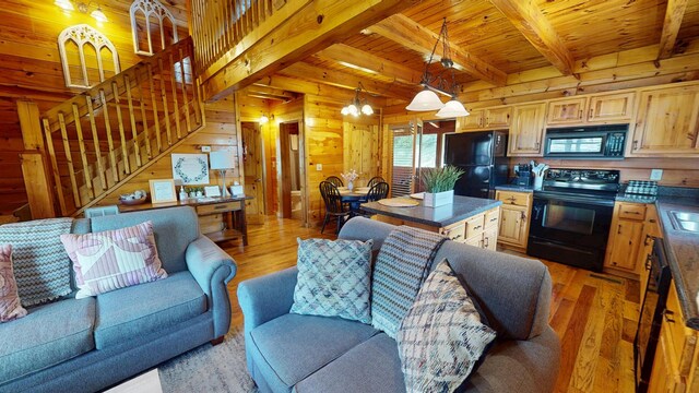 dining area with wooden ceiling, beamed ceiling, wood walls, and hardwood / wood-style floors