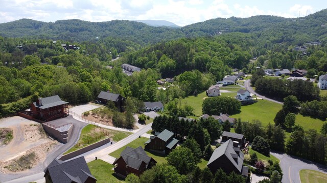 bird's eye view with a mountain view, a residential view, and a forest view