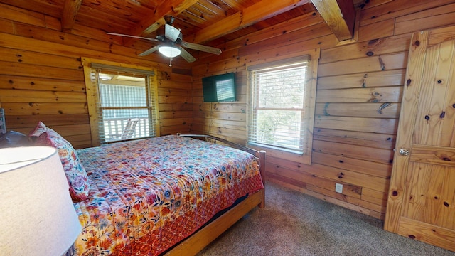 carpeted bedroom featuring wood walls, beam ceiling, and wooden ceiling