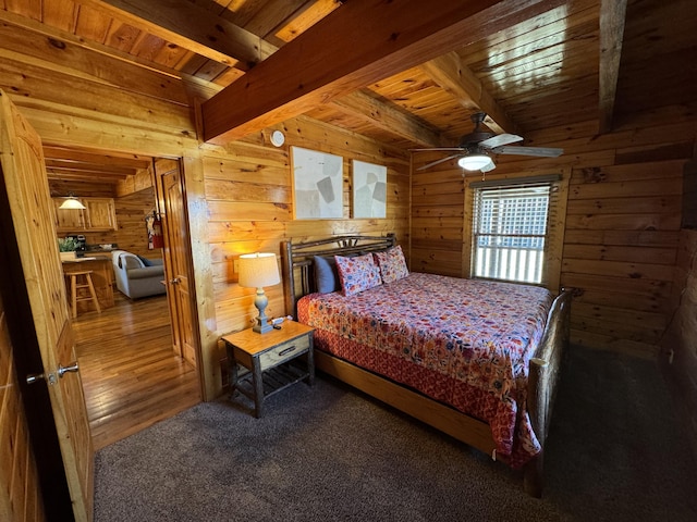 bedroom with carpet, beamed ceiling, wooden ceiling, and wooden walls