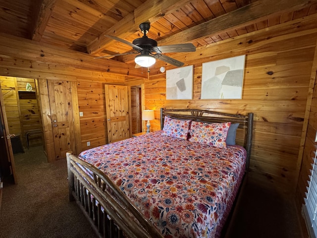 bedroom with ceiling fan, wooden walls, wood ceiling, beamed ceiling, and carpet