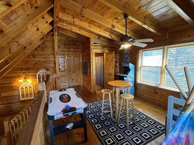 playroom with wood ceiling, wooden walls, and hardwood / wood-style floors