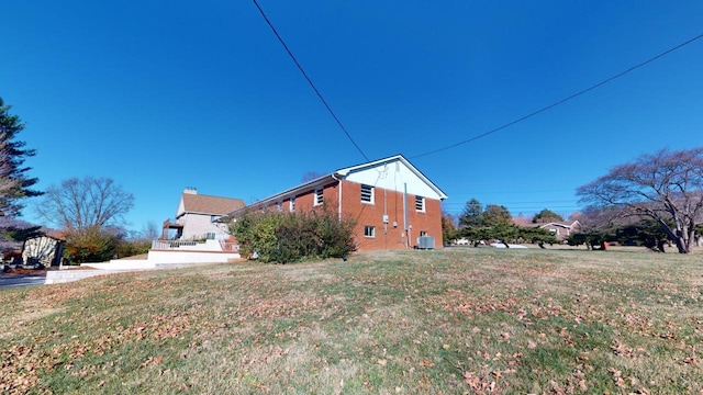 view of home's exterior with a yard