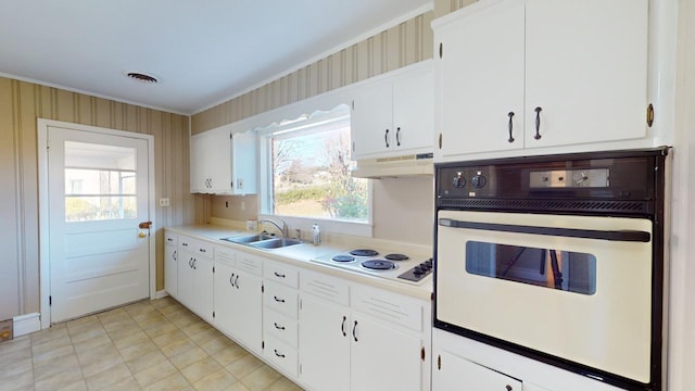 kitchen with white cabinets, white appliances, and sink