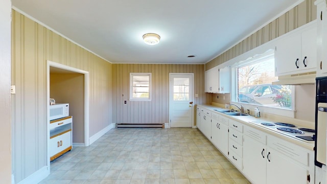 kitchen with sink, white cabinets, white appliances, and a baseboard heating unit