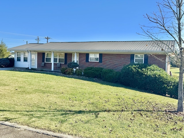 ranch-style home with a front lawn