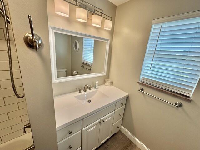 full bathroom with vanity, shower / bathtub combination, and toilet