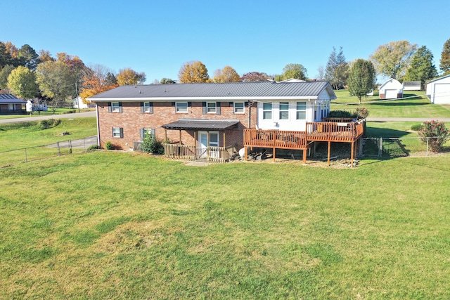 rear view of property featuring a pergola, a wooden deck, and a yard