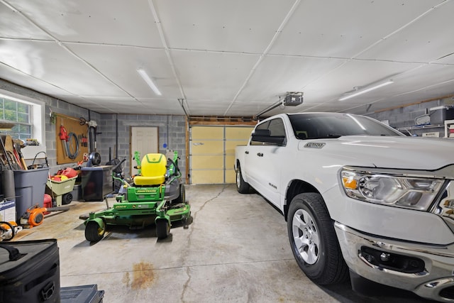 4705 E Hampton Blvd, Morristown, TN 37813 - garage with a garage door opener and concrete block wall