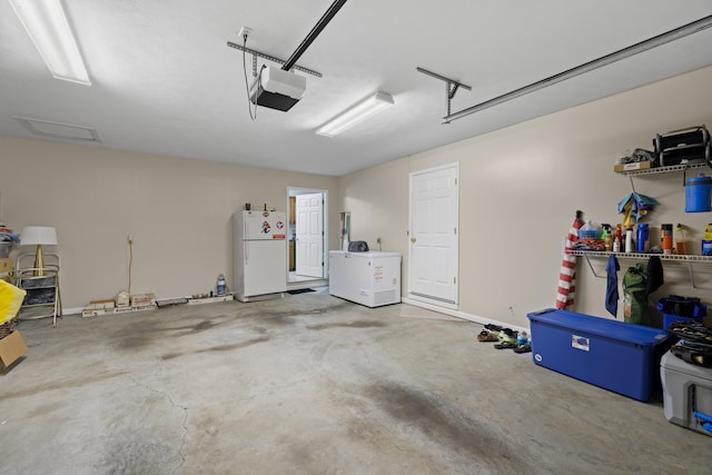 4705 E Hampton Blvd, Morristown, TN 37813 - garage with freestanding refrigerator and a garage door opener