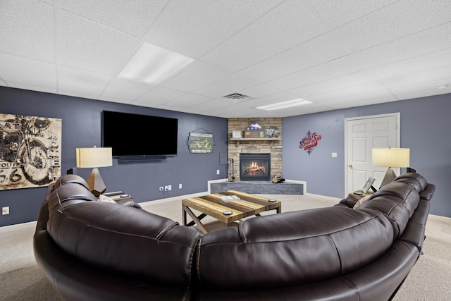 4705 E Hampton Blvd, Morristown, TN 37813 - living area with carpet floors, a fireplace, a paneled ceiling, and baseboards