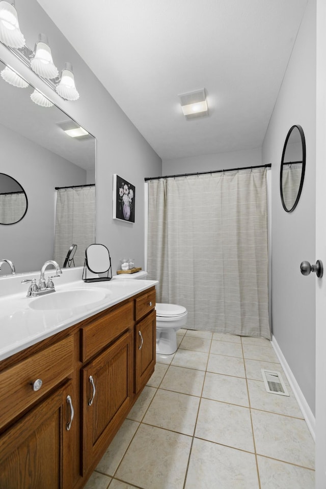 4705 E Hampton Blvd, Morristown, TN 37813 - bathroom with vanity, tile patterned flooring, and toilet