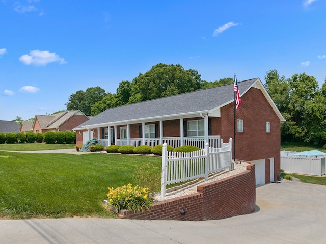 4705 E Hampton Blvd, Morristown, TN 37813 - single story home featuring covered porch, driveway, brick siding, and an attached garage